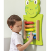 child playing with wall mount frog abacus