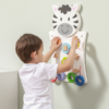 child playing with wall mount shape zebra