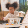 girl playing with Noah's Ark Shape Sorter