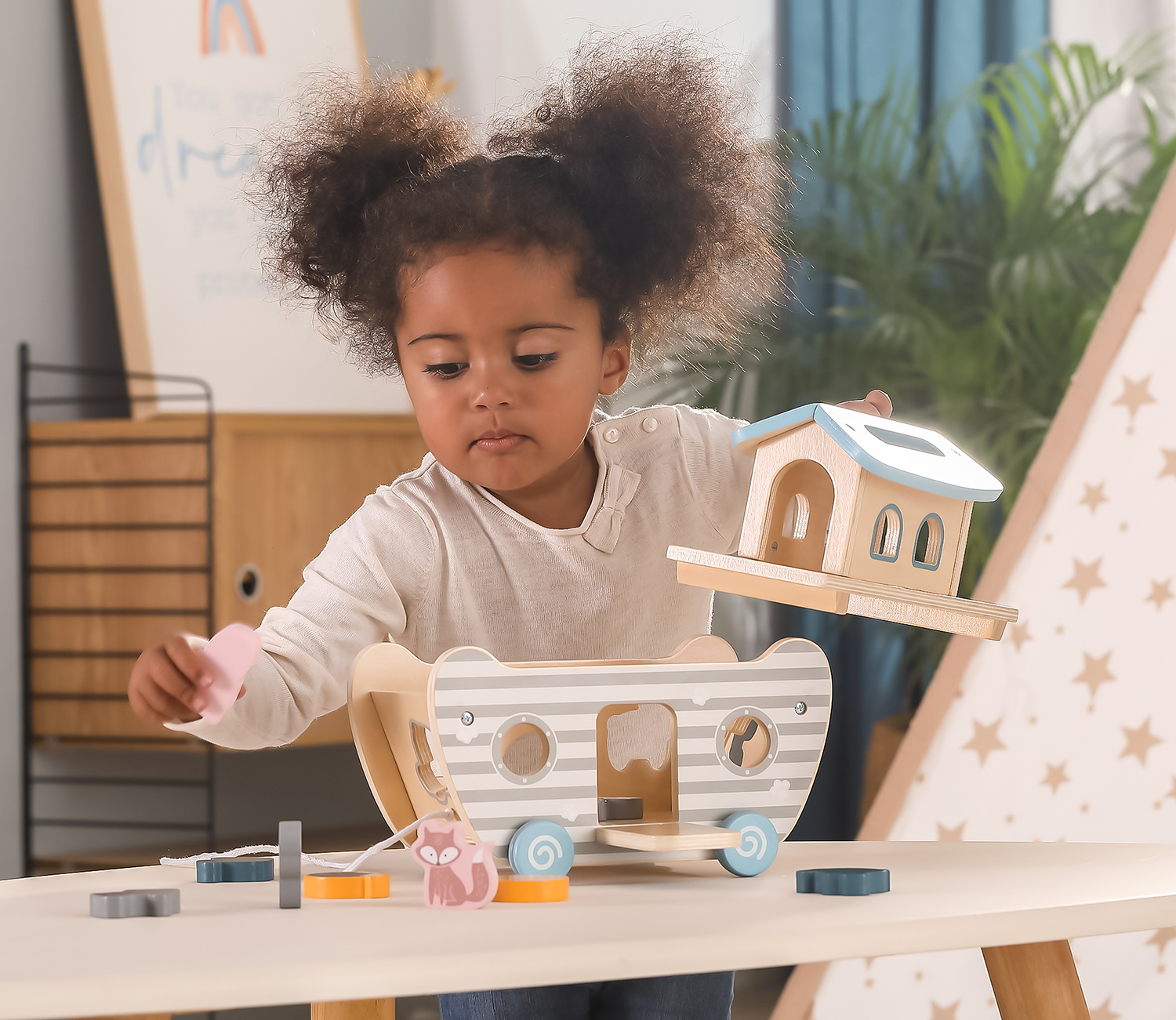 girl playing with Noah's Ark Shape Sorter