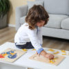 child building montessori puzzles