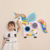 child playing with this multifunctional unicorn wall toy